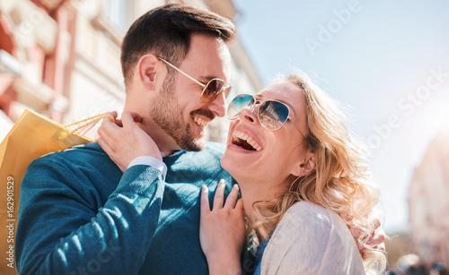 Shopping time. Young couple in shopping. Consumerism, love, dating, lifestyle concept