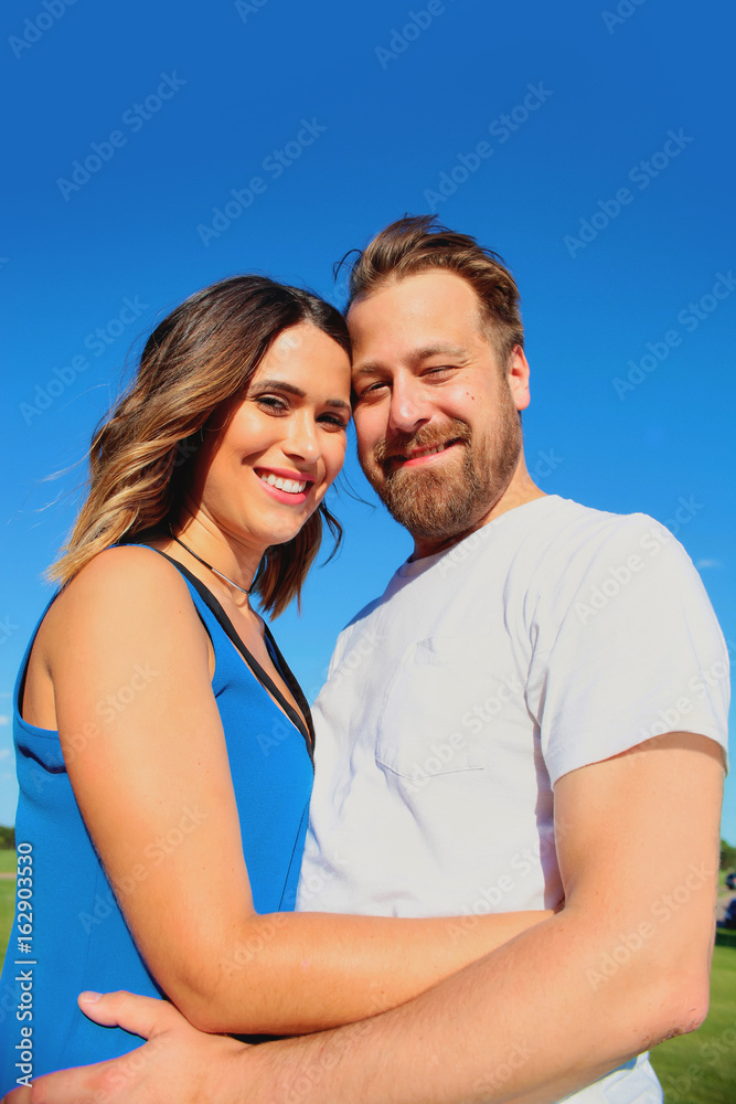 Portrait of happy young couple standing together Portrait of happy young couple standing together