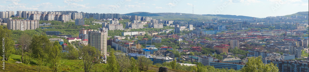 View of the city from the mountain, summer in the North