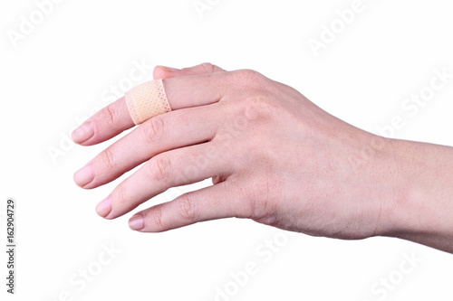 Medical plaster on the finger isolated on a white