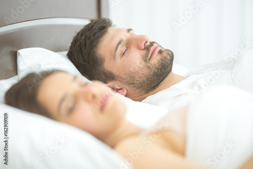 The lovers sleeping in the bedroom