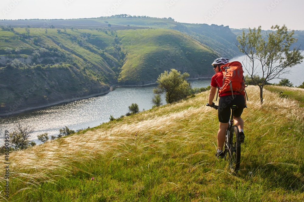 Adventure mountain biking on riverside