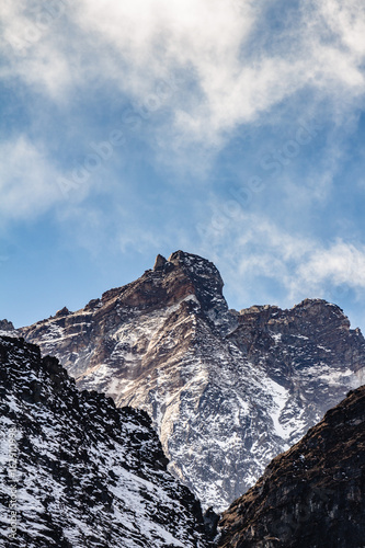 Close up shot of Black mountain with snow and cloud on the top at Thangu and Chopta valley in winter in Lachen. North Sikkim, India. photo