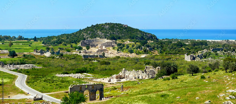 Antique ruins, amphitheatre and gate near Patara beach,Turkey.