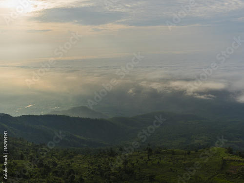 Fog and clouds mountain landscape with sunshine in morning