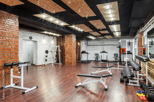 Interior view of a gym with equipment.