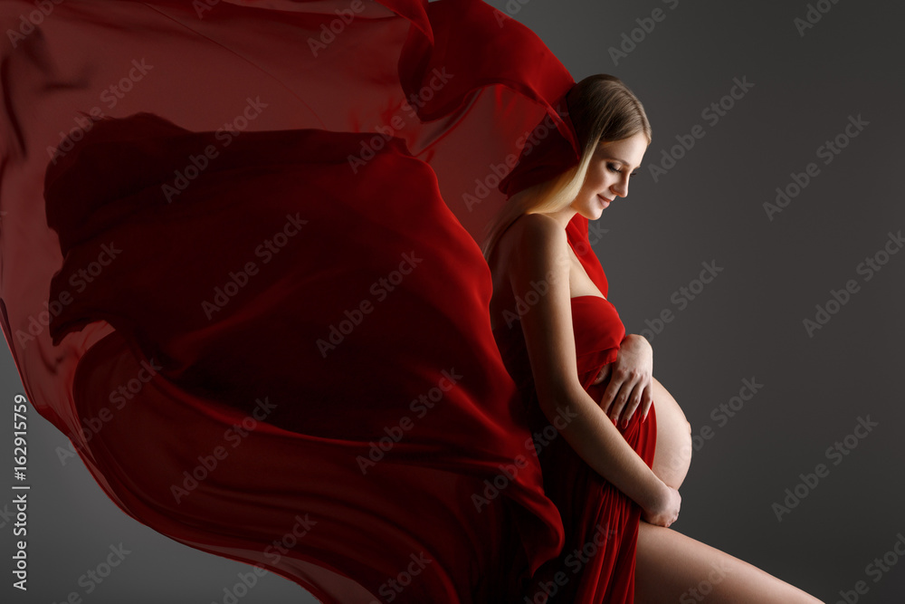 Pregnant girl in red dress
