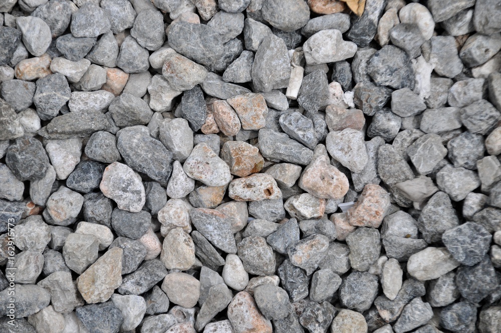 Naturally polished rock pebbles background, rock abstract background Naturally polished rock pebbles background, rock abstract background