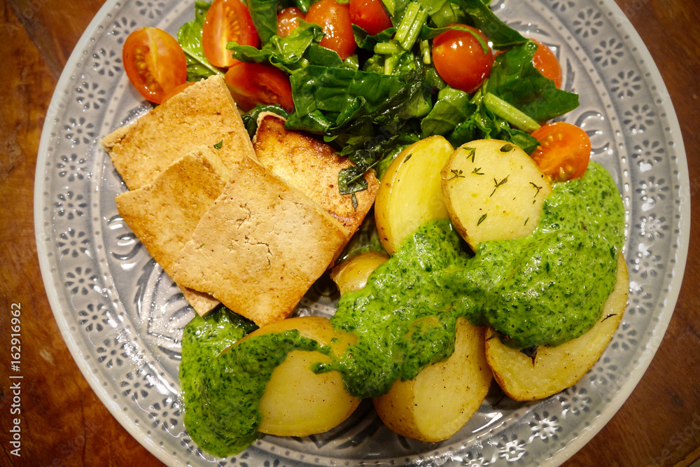 Tofu with potatoes and salad Gebratener Tofu mit Kartoffel und Salat ...