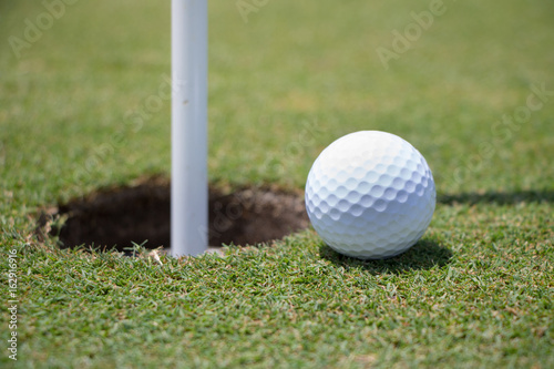 Golf Ball Near Hole 
