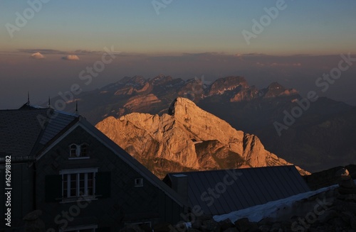 Golden mountains of the Alpstein Range. View from Mount Santis. photo