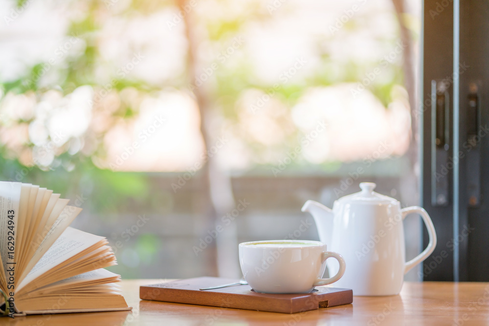 coffee cup and book on the table coffee cup and book on the table
