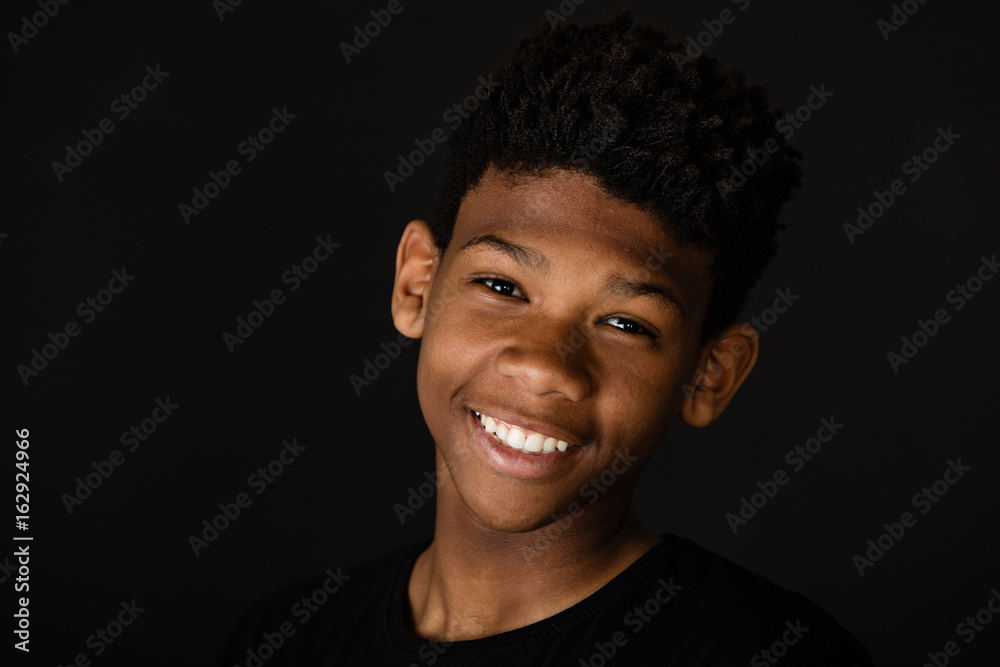 Smiling happy young African boy