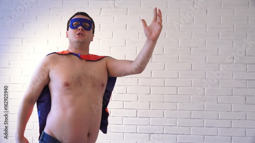 Картината върху платно A fat man in a superhero costume rushes to the rescue