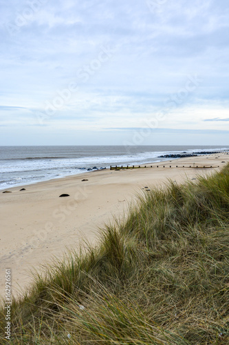 Dunes and beach at the coast of Norfolk in England