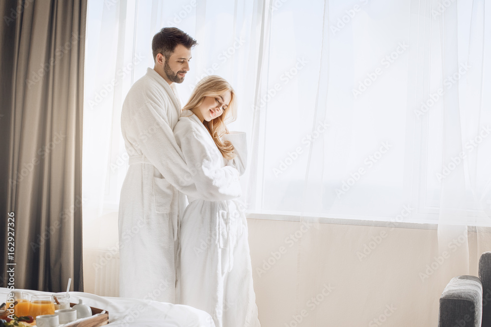 Young couple travel together hotel room leisure Young couple travel together hotel room leisure