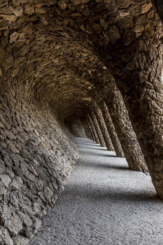Tunnel passage with pillars from south at park Güell in Barcelona vertical