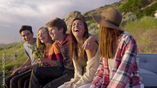 Group Of Happy Teens Laugh Really Hard, Their Friend Surprises Them And Hugs Them, They Laugh More (Slow Motion)