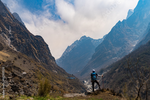 The man looking the way from Deurali to Machapuchare base camp ,Nepal.