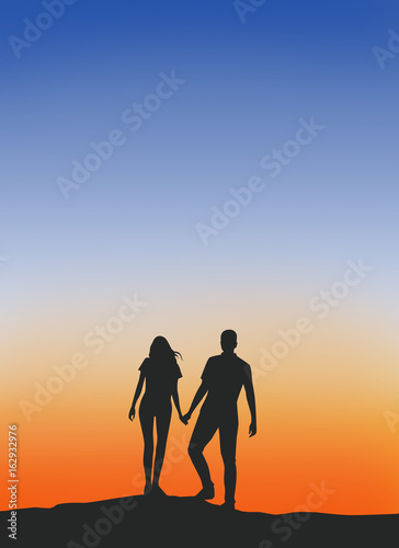 Male and female couples Walking hand in hand warm silhouette .