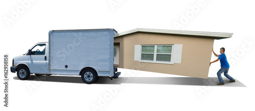 Fotografía Man struggling cramming home house into moving truck van on day move representing hard work difficulties and needing a bigger truck, difficult professional moving company and hiring help workers