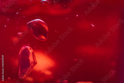 air bubbles in a red jelly. the background of jelly