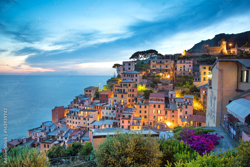 fabulous romantic landscape in Riomaggiore on the evening in Cinque Terre, Liguria, Italy, Europe.