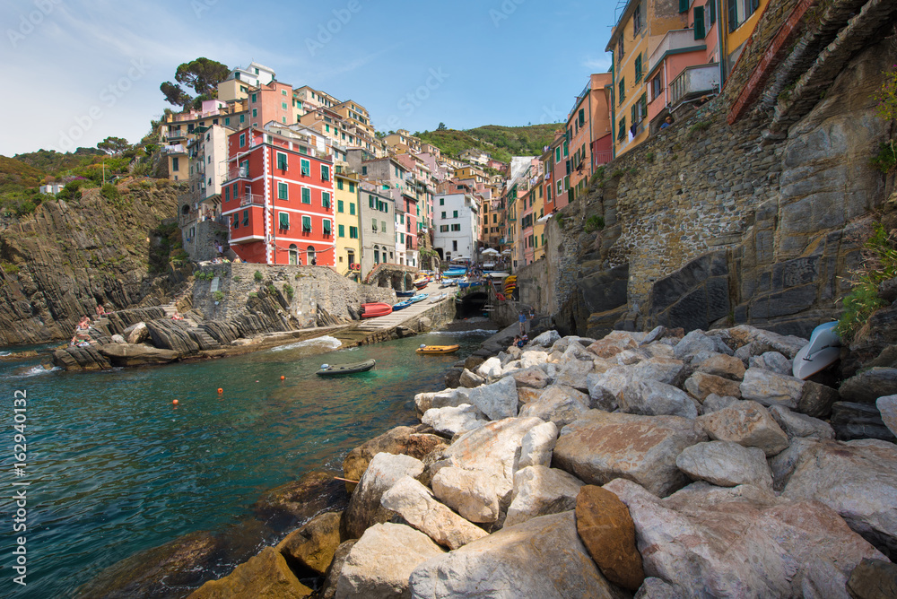 Beautiful summer landscape with stones on the coast of Riomaggiore in Cinque Terre, Liguria, Italy, Europe