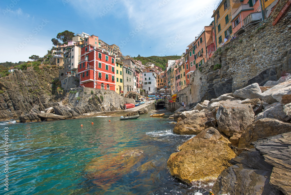 Beautiful summer landscape with stones on the coast of Riomaggiore in Cinque Terre, Liguria, Italy, Europe