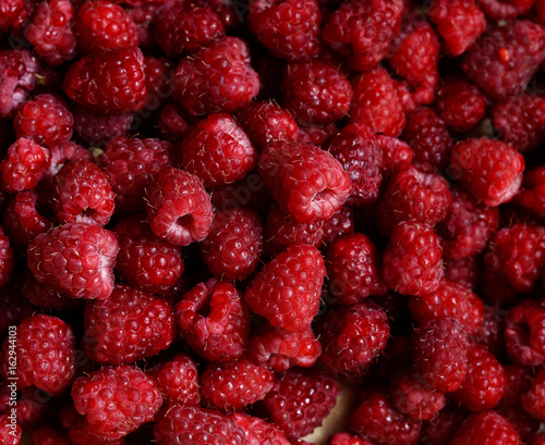 Raspberry fruits background. Summer season backdrop.