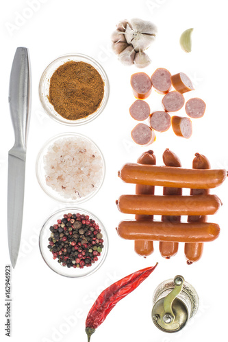 Small smoked sausages on white background.