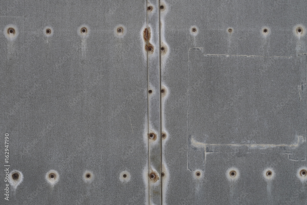 Industrial steel metal background with rusted nails