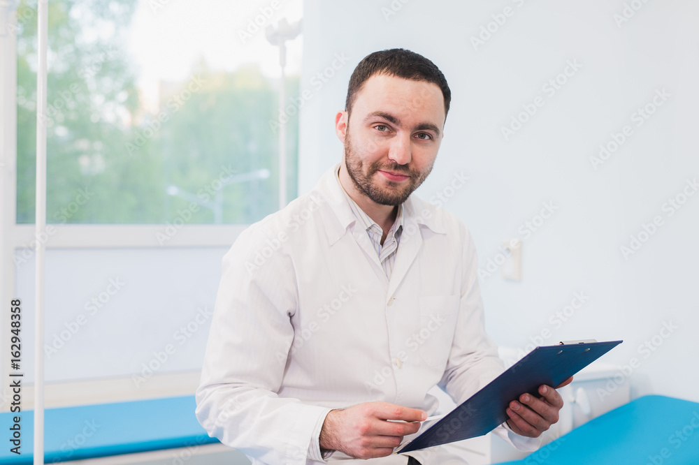Portrait of handsome mature doctor in office Portrait of handsome mature doctor in office