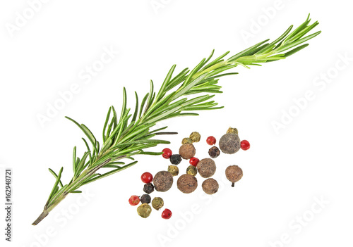 Fresh rosemary and pepper isolated on white background