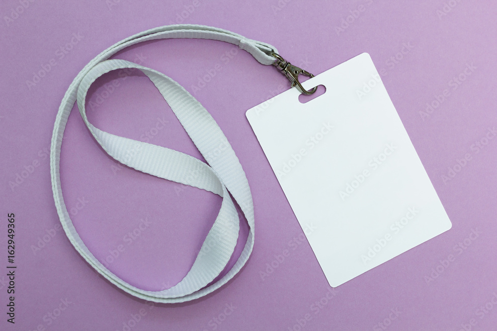 Blank badge with lanyard on purple background, empty space for text. Blank badge with lanyard on purple background, empty space for text.