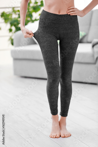 Young girl in grey pants for yoga photo