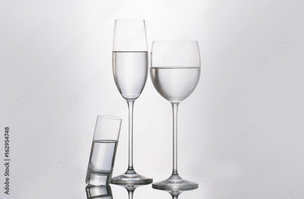Isolated glass and cup of water Isolated glass and cup of water