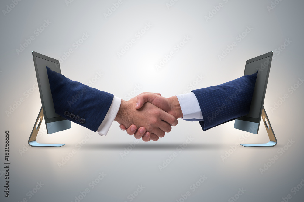 Two hands from screen in handshake concept Stock Photo Adobe Stock