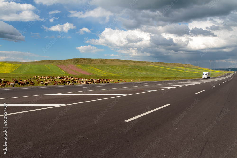 Highway. Open views and sunny weather to travel.