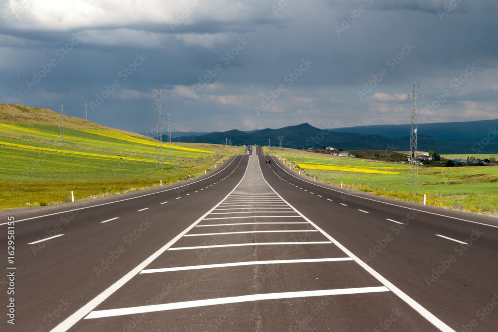 Fototapeta premium Highway. Open views and sunny weather to travel.