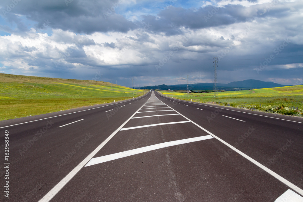 Highway. Open views and sunny weather to travel. Highway. Open views and sunny weather to travel.