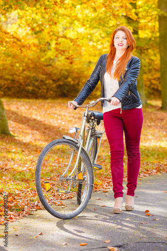 Young girl with bike. © Voyagerix