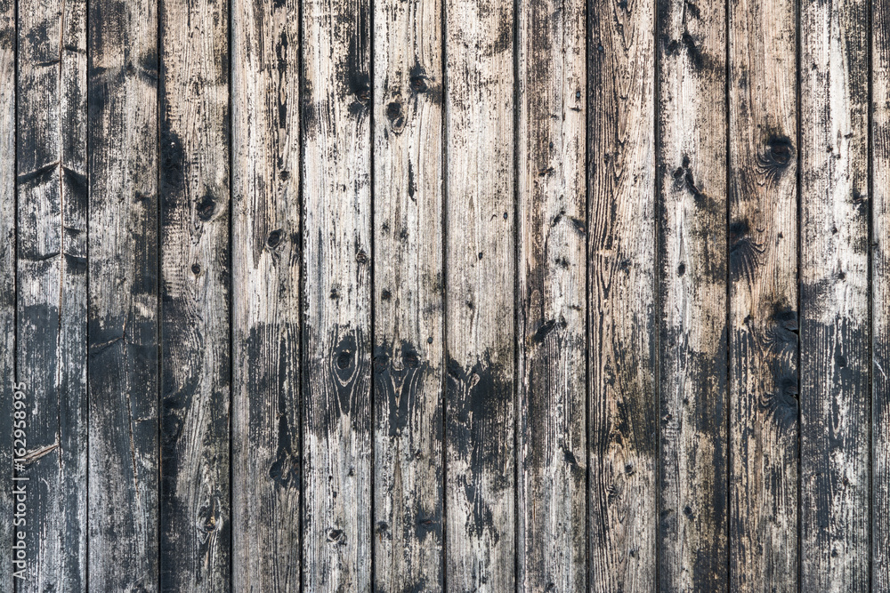 Vintage wooden background from planks with knots.