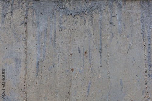 Rough concrete wall texture with rust marks