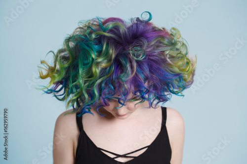 Colored hairs. Portrait of beautiful women with flying hairs and rhinestones . Ombre. Gradient