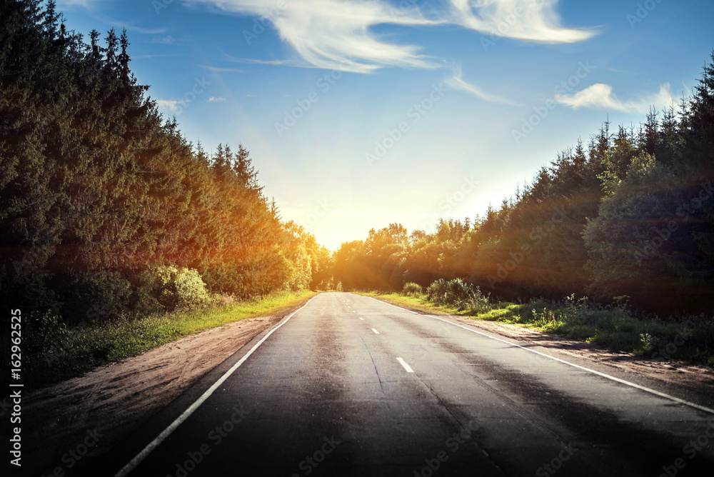 Fototapeta premium Sunrise beautiful road in forest