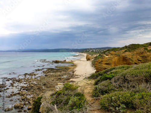 Endless beach coast with cloudy sky