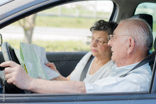 elderly couple in the car © auremar