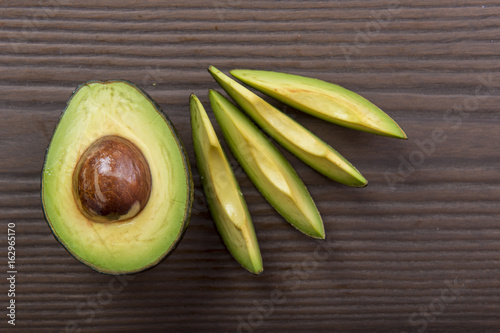 Avocado on wood table ,Healthy food concept