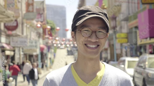 Happy Tourist Smiles And Enjoys Chinatown, San Francisco 